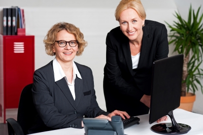 Women Working In Office by stockimages