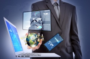 Business Man With Laptop,mobile Phone,touch Screen Device by jannoon028